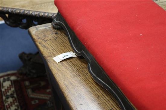 A Victorian ebonised fender stool and a Victorian footstool W.134cm, W.44cm